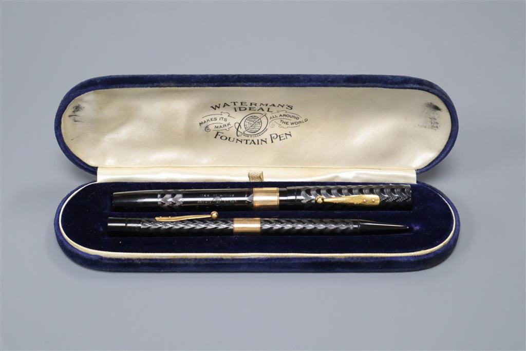 A 9ct gold mounted Watermans fountain pen together with a similar pencil